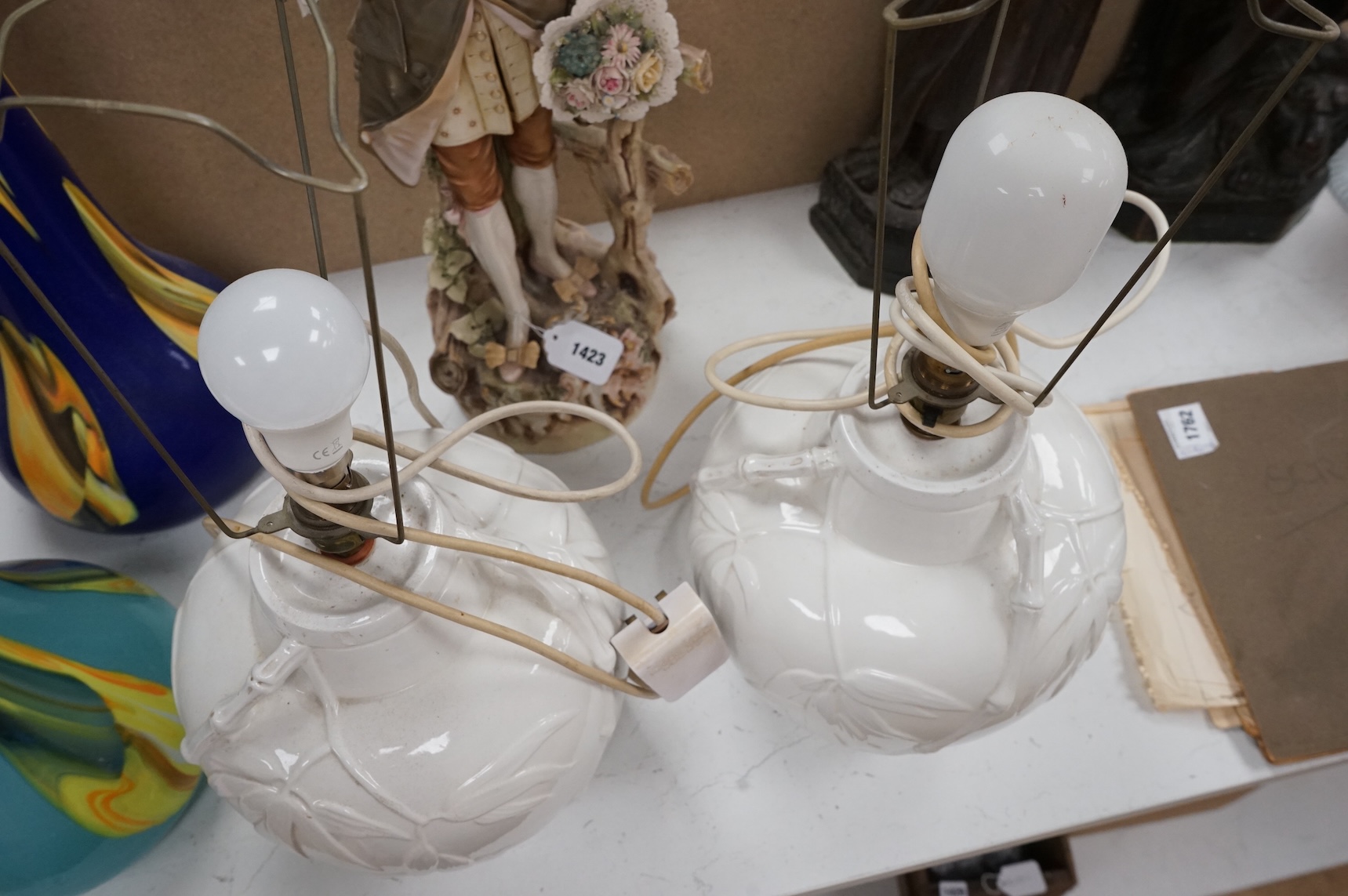 A pair of Chinese porcelain table lamps decorated with bamboo